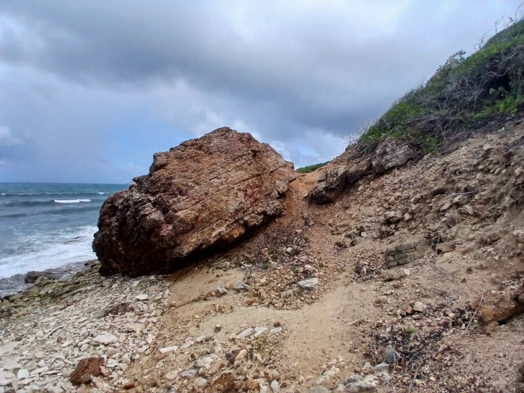 Climb over rock on the right side